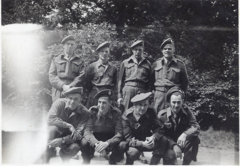 “B” Coy., Baarn Holland (June 1945)
Front Row (L to R)
CSM Mcleod, Sgt. Tuttle, CQMS Kerr, CPL. Peltier

Rear
Lt. MacAthur, CQMS. How, Major Crig, Capt. Pollard