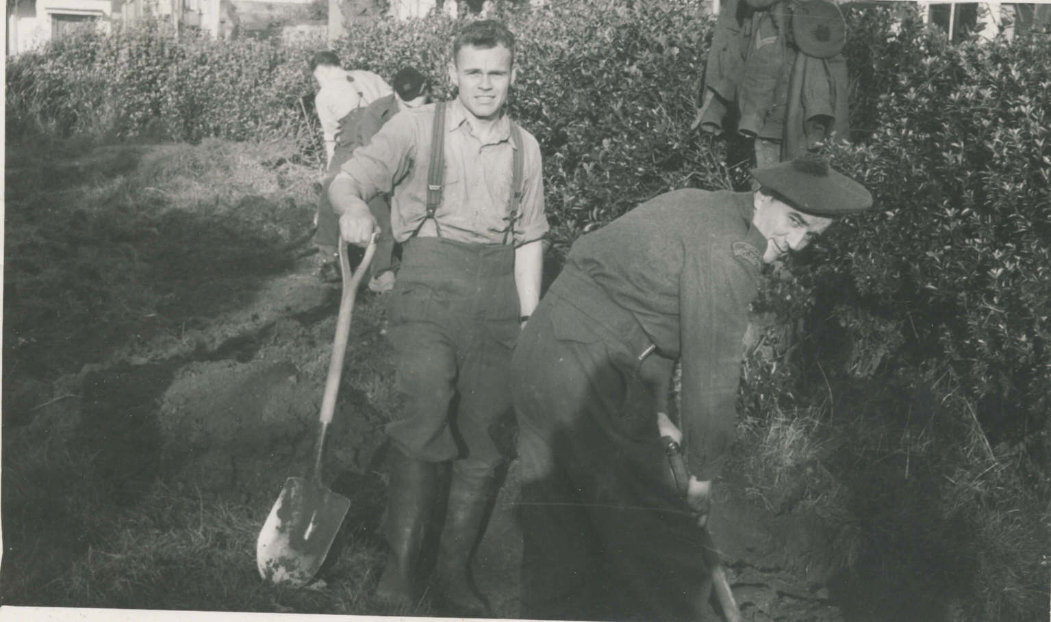 English Coast (December 17th 1941)
Taken by Capt. Freele M.O.
George Marie & myself, digging trenches near our house, for our bomb shelters. Albert Schmidt with his back to camera.