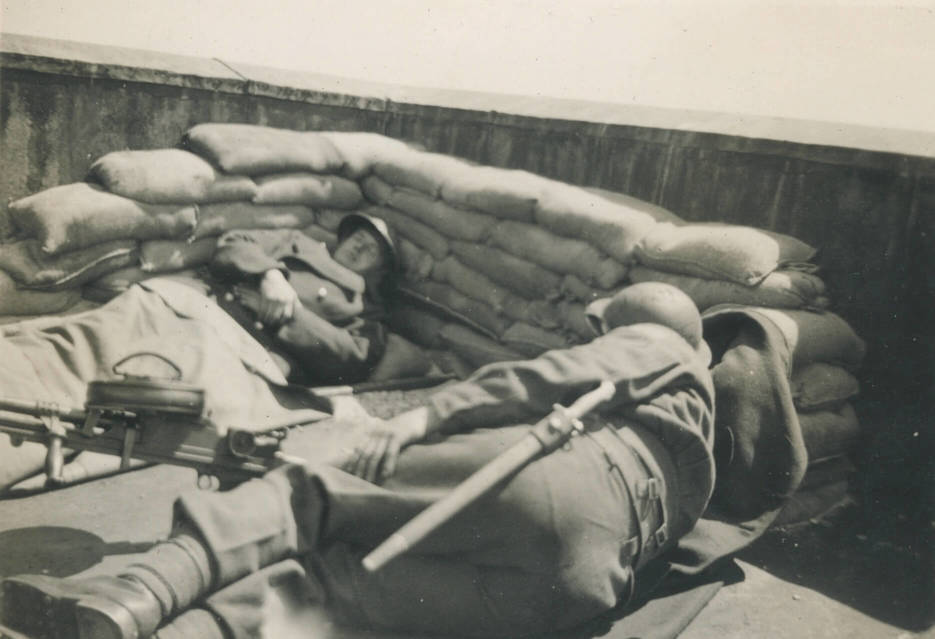Bognor Regis, England (April 1942)
Asleep on the job, Buck Johnson and Red Orton, on top of pier roof.