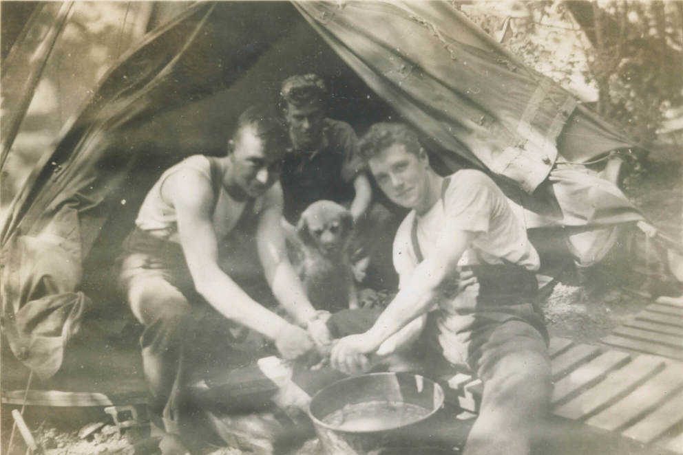England (June 1942)
Hank Murray, Gordie Gremen and Pat McQuiggan and Paddy (A Coy. mascot) doing a little washing.