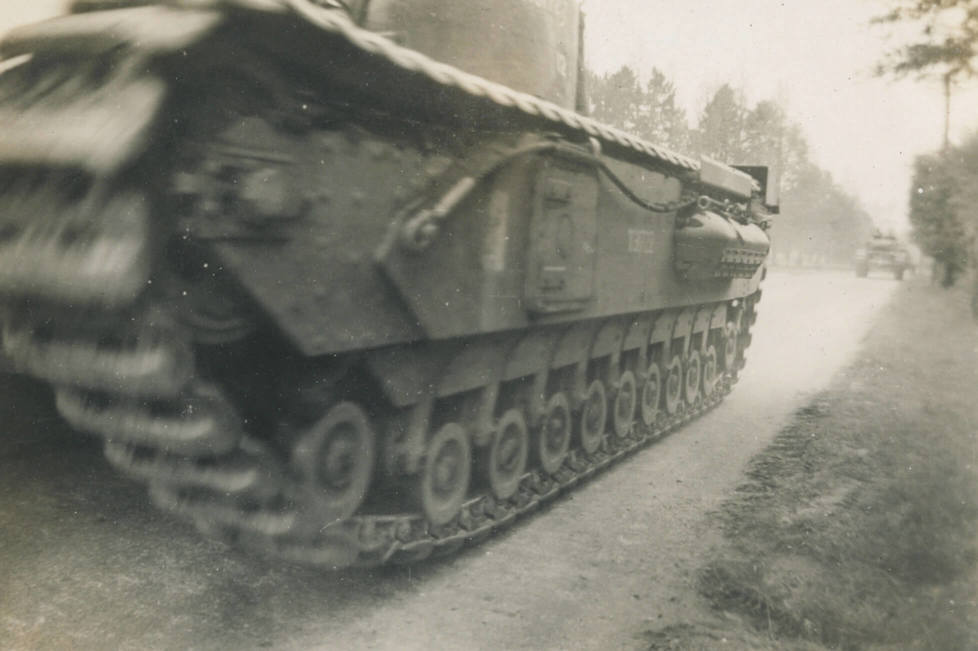 England (May 1942)
Churchill Tank
A column of our 40 ton tanks rolling by on one of our schemes.